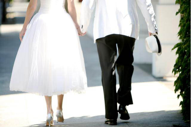 Bride and groom walking away