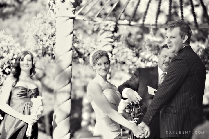 bride and groom say vowes under arch, La Caille wedding venue, Salt Lake City Utah wedding, Kayleen T photography, ruby red slippers 20090906-IMG_7799-Editbw