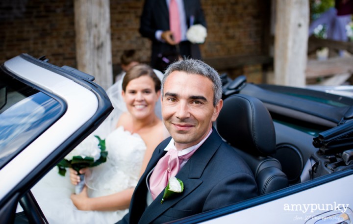 bride and groom getaway car shot convertible, Chateau de la Ferte Saint Aubin, Amy Punky photography, Atelier Diagonale