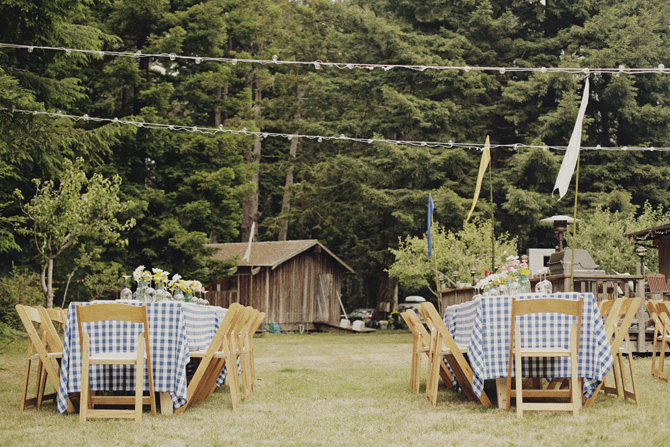 rustic backyard rehearsal dinner, blue and white plaid table linen, outdoor rehearsal dinner inspiration, farm inspiration, ranch inspiration, wooden chairs