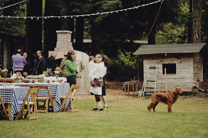 rustic backyard rehearsal dinner, blue and white plaid table linen, outdoor rehearsal dinner inspiration, farm inspiration, ranch inspiration, wooden chairs, mason jar centerpiece