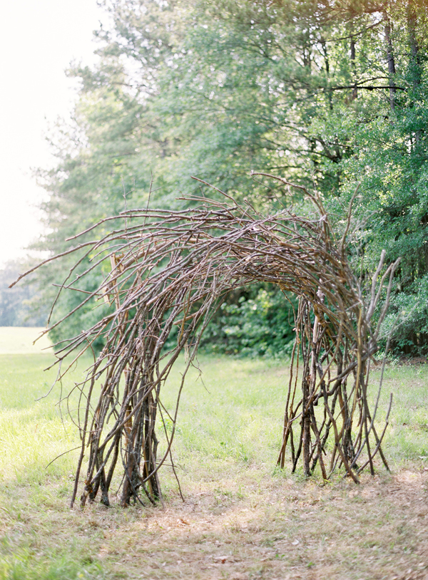 Wooden ceremony arch photo by Jose Villa via Once Wed