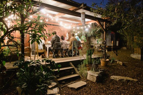 Sustainable dinner party inspiration, hunt and gather, backyard dinner party, cafe lights, mix and match chairs, vintage glassware __Brandi_Welles_Photographer_20121030huntandgather00192PRINT_low