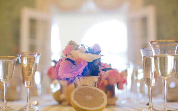 Citrus Bridal Shower, floral arrangement, lemon, dining room, gold trimmed glasses