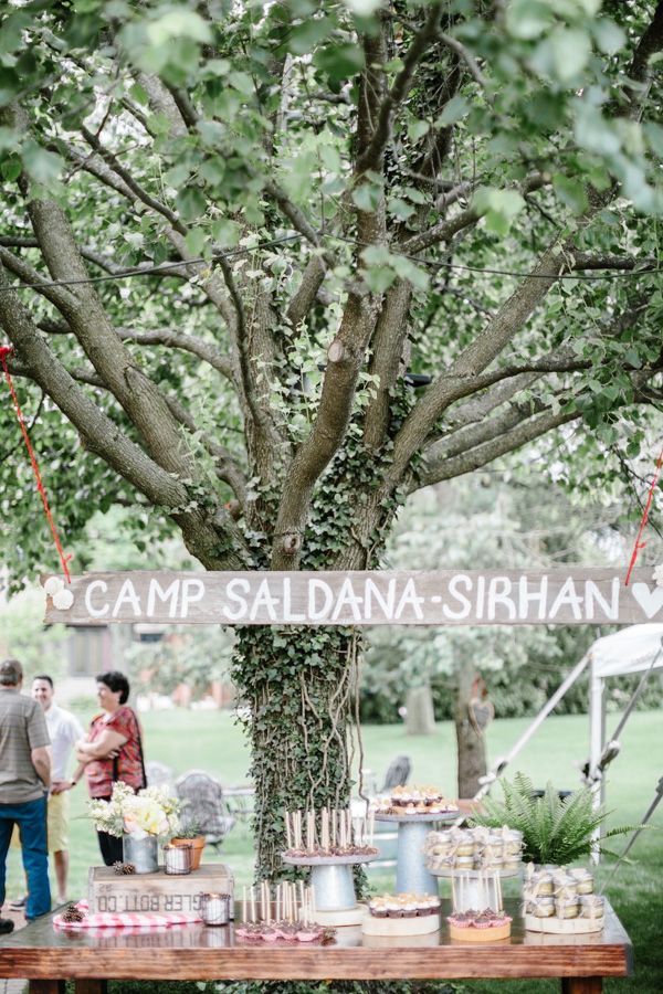 couples camping shower, wooden sign, dessert table, wilderness