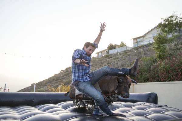 texan going away party, mechanical bull, southern style, plaid, denim, fun, play, ride, jeans