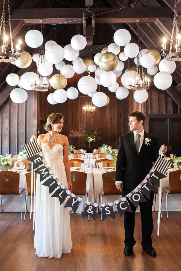 Minted's New Wedding Reception Decor Packages, botanical wreath theme, gold, white, lanterns, chandeliers, table runners, banner, groom, bride