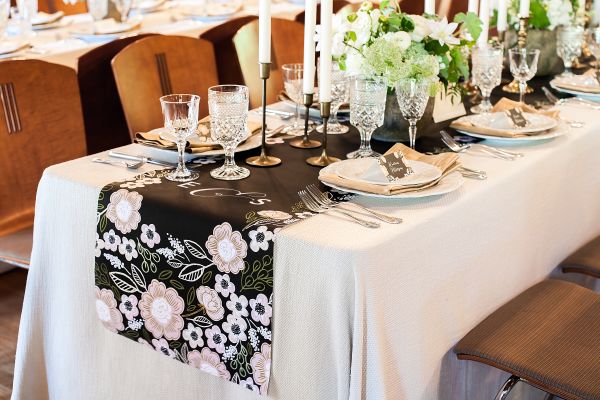 Minted's New Wedding Reception Decor Packages, botanical wreath theme, table runner, florals, taper candles, gold, crystal