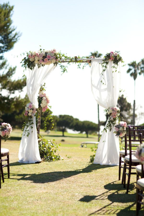 birch arch with chiffon draping and pink flowers - Ultrapom Event Rental